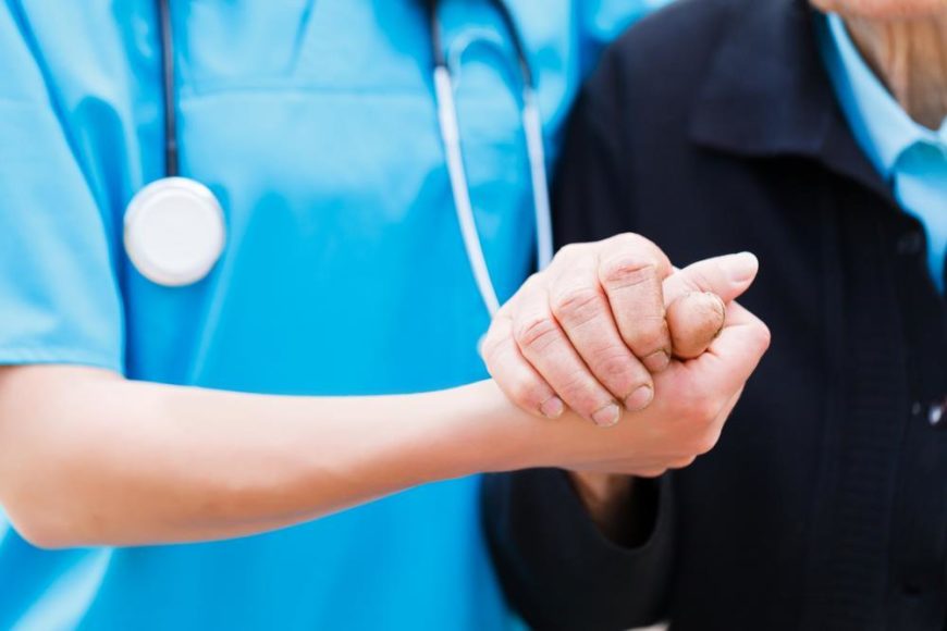nurse helping patient
