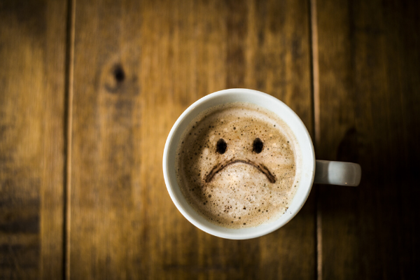 hurt feelings sad face in coffee