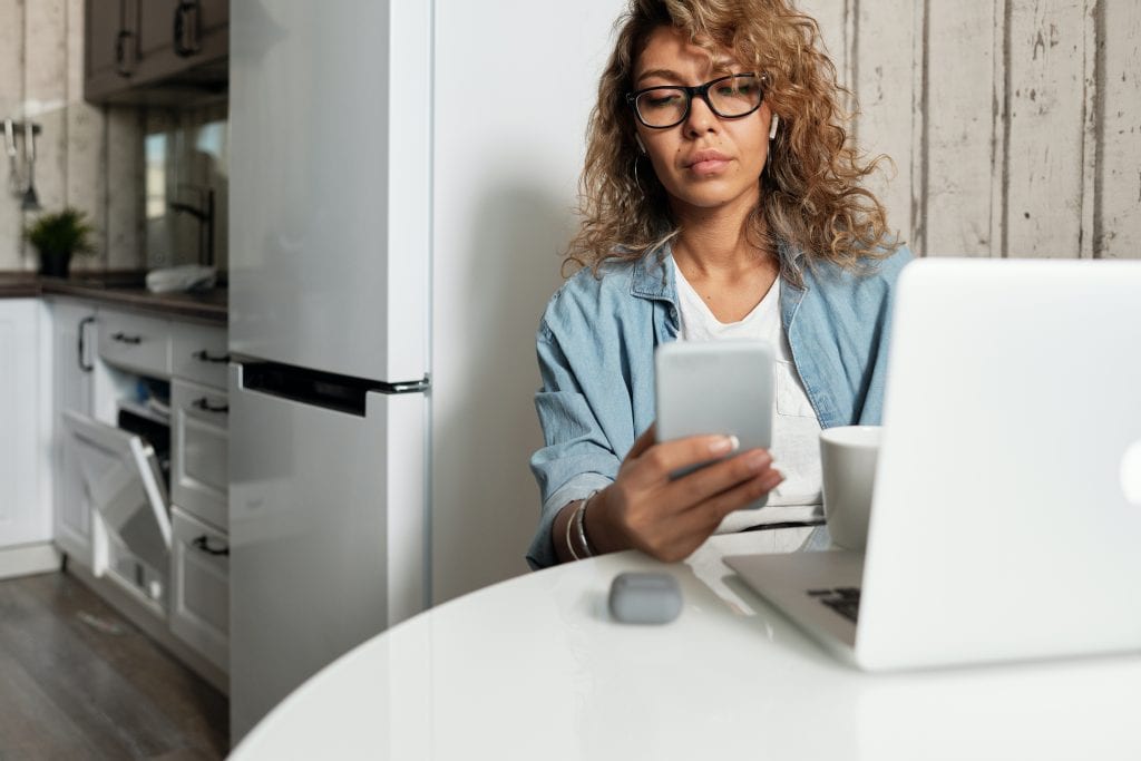 A woman texting on a cell phone