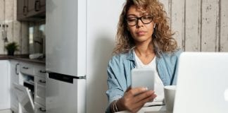 I Can’t Quit Mom Shaming Myself A woman texting on a cell phone