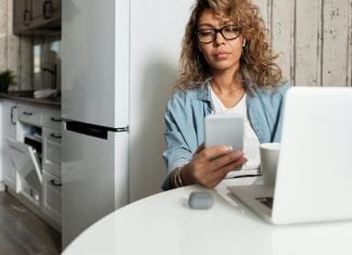 I Can’t Quit Mom Shaming Myself A woman texting on a cell phone