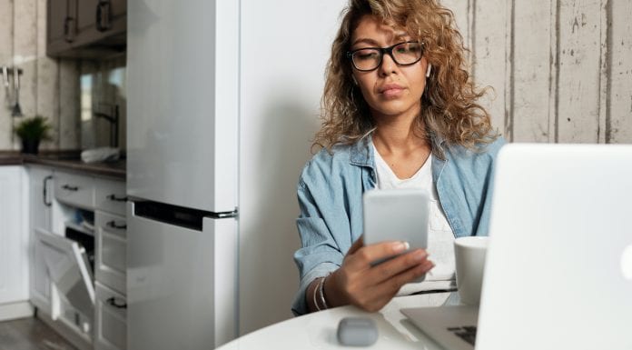 I Can’t Quit Mom Shaming Myself A woman texting on a cell phone