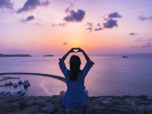 woman watching sunset