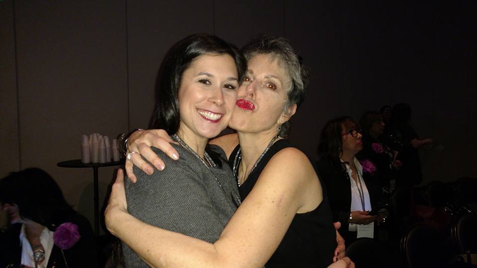 author, a mom, hugging her adult daughter