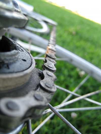 tipped over bike- wheel, chain, and spokes