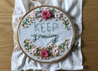 How COVID-19 Helped Me Get Along Better with My Quaranteens Embroidery in a hoop, done by a teen, that says "keep growing."