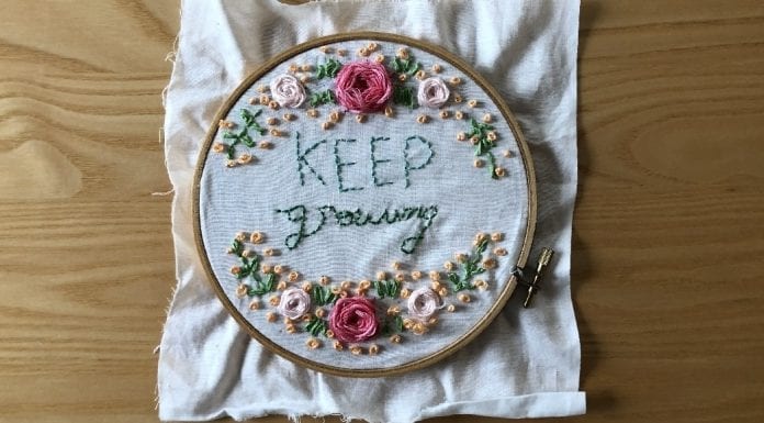 How COVID-19 Helped Me Get Along Better with My Quaranteens Embroidery in a hoop, done by a teen, that says "keep growing."