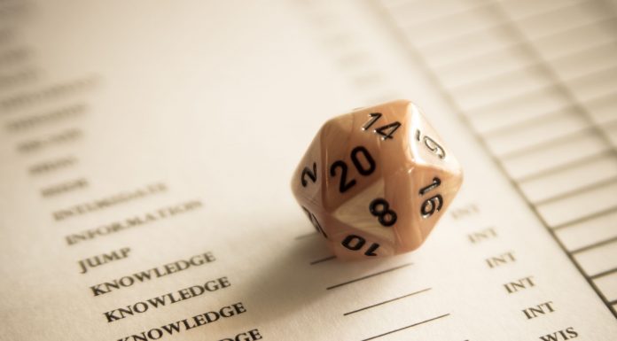 A 20 sided dice on a character sheet for role playing games