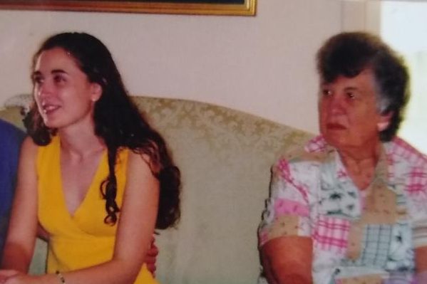 author sitting on the couch with her grandmother