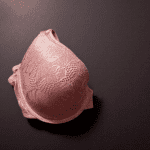 half of a pink bra