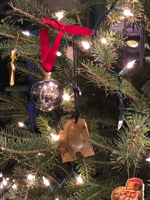 Nipple shield for radiation treatment as an ornament on a themed Christmas tree