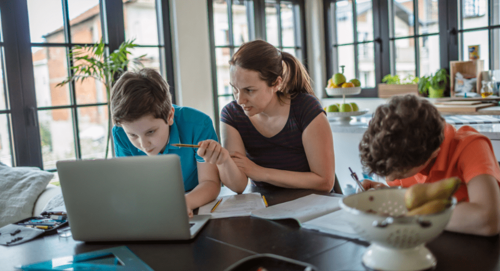 mother homeschooling two sons