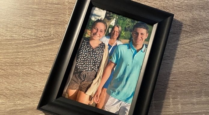 Making Up for the Mother Wound: A Letter to My Future Adult Kids A teenage boy and girl walking along the sidewalk in summer with a woman smiling in the background.
