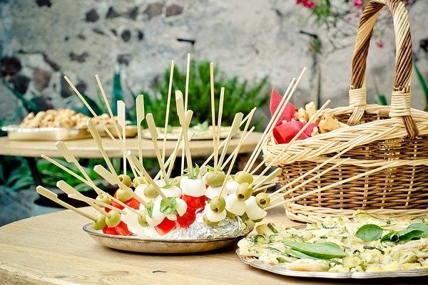 appetizers on a table for a potluck meal