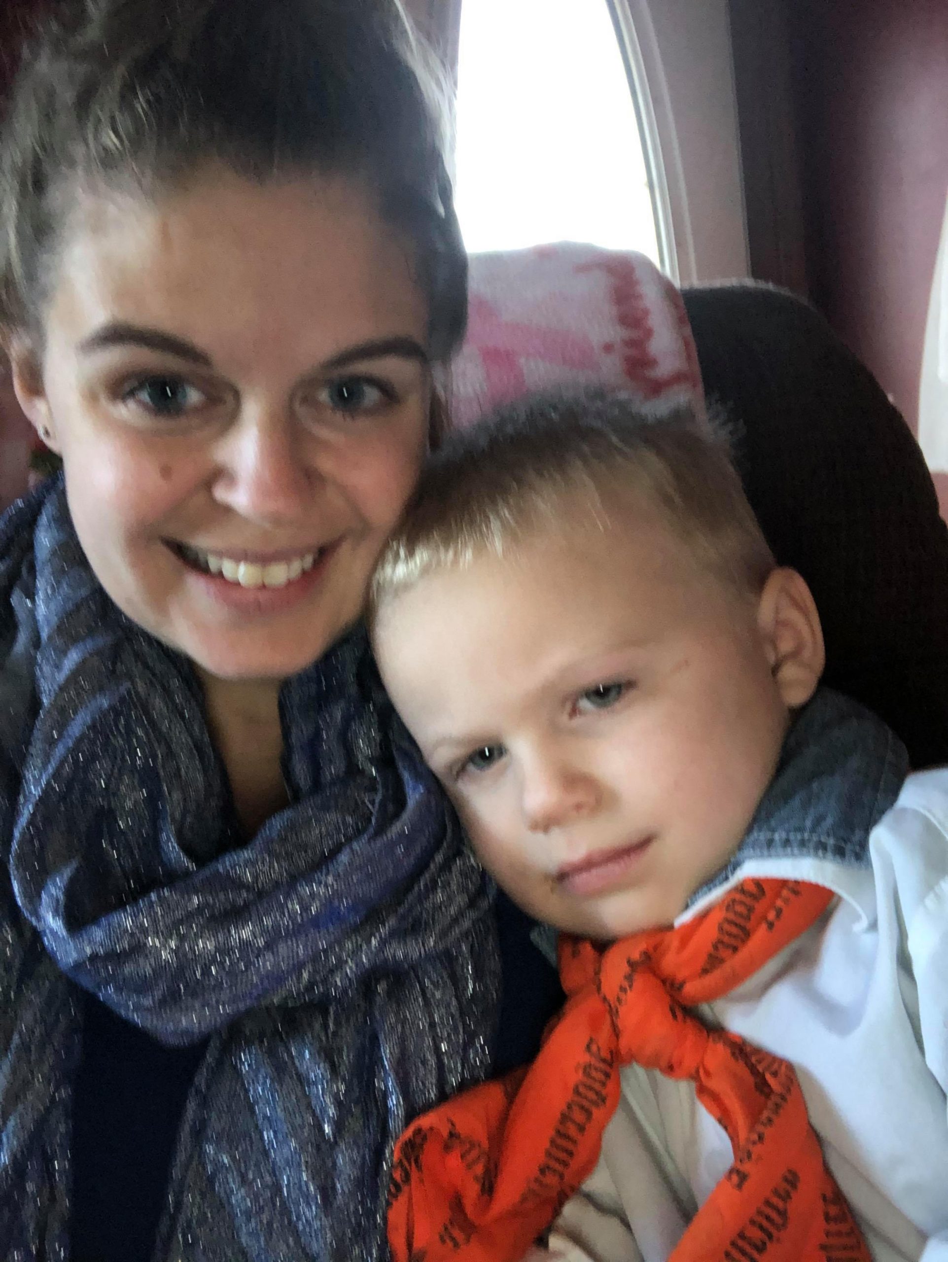 mother cradles toddler son to help managing meltdowns