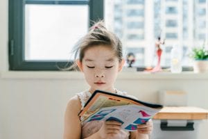 child reading book
