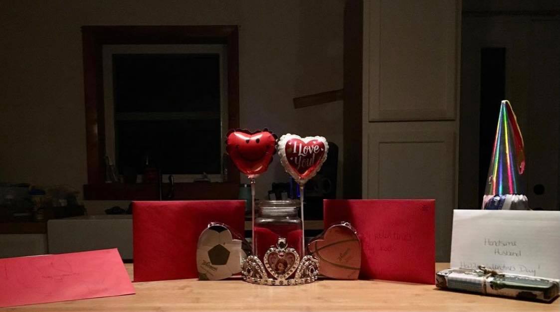 Valentine's Day set-up with small balloons and a small gift