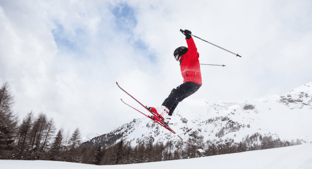 child jumping on skis