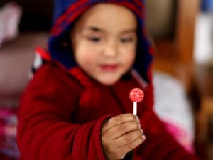 kid with lollipop