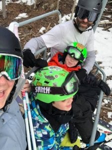 family on a ski lift