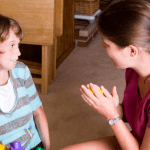 autistic girl with her teacher