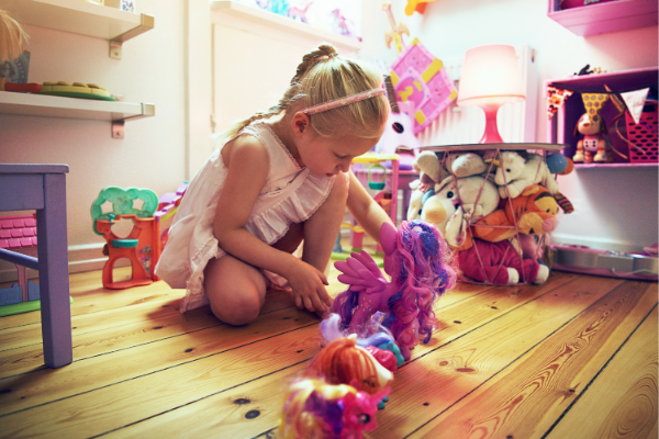 Autistic child lines up toy horses