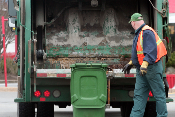 garbage man loading garbage into the truck