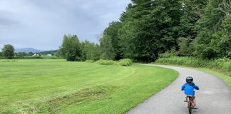Five Full Days of Daycation Ideas for Families in Vermont boy biking on the Stowe Bike Path