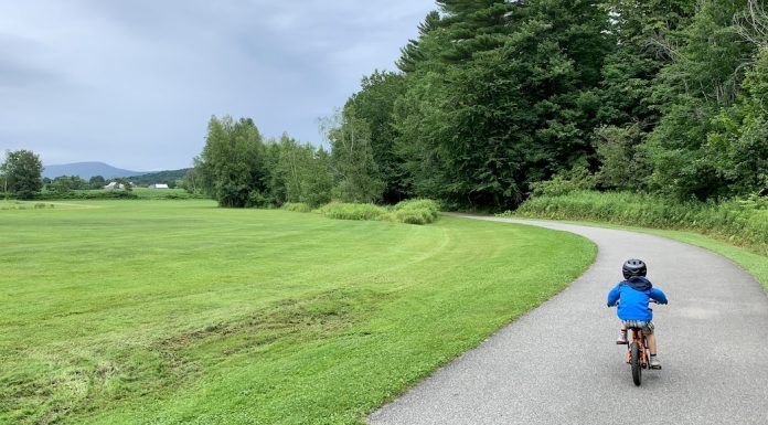 Five Full Days of Daycation Ideas for Families in Vermont boy biking on the Stowe Bike Path