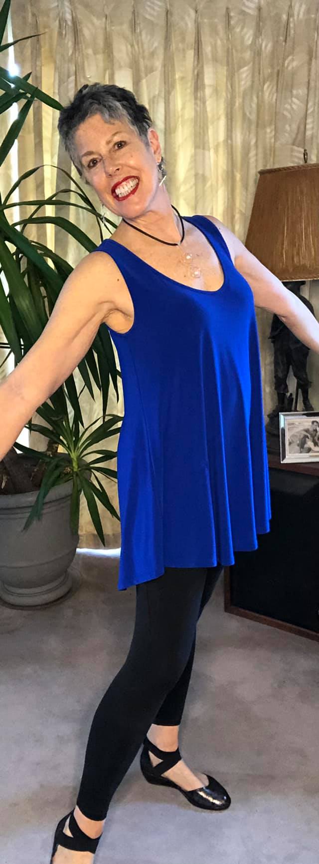 woman in a flowing blue top