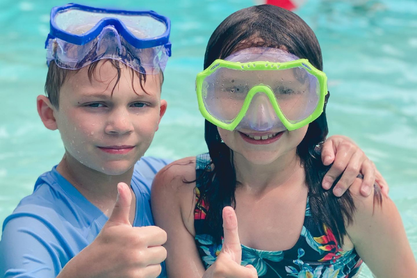 two kids in a campground pool