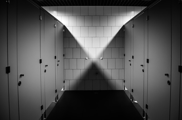A black and white image of a public bathroom