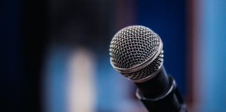 Disabled Enough: The Thing About #FreeBritney That Bugs Me A photograph of a microphone against a blurred background