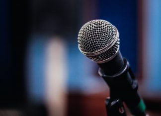 Disabled Enough: The Thing About #FreeBritney That Bugs Me A photograph of a microphone against a blurred background