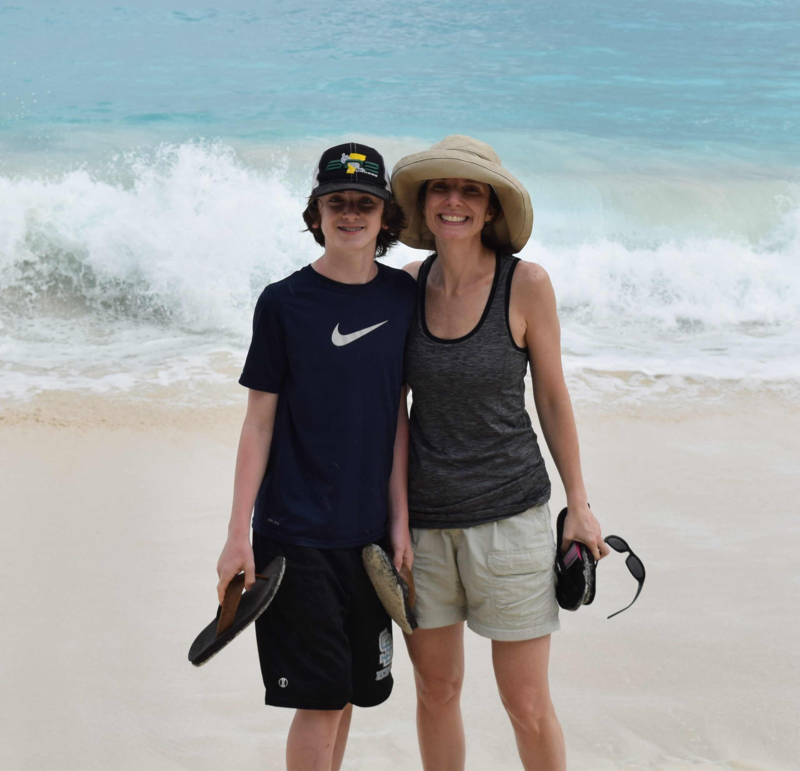 teenaged son and mom at the beach