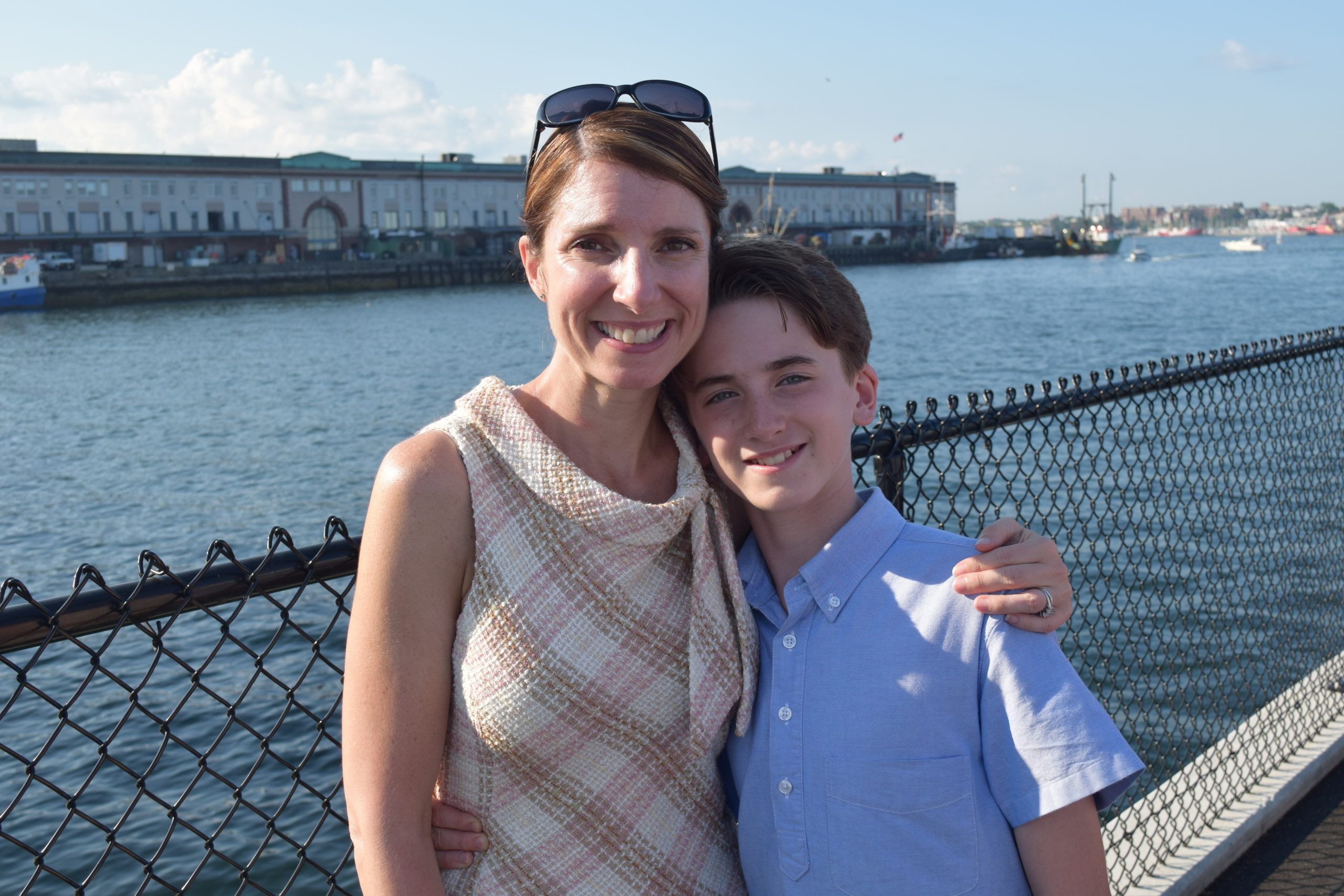 boy standing with his mom