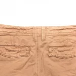 khaki pants against a while background