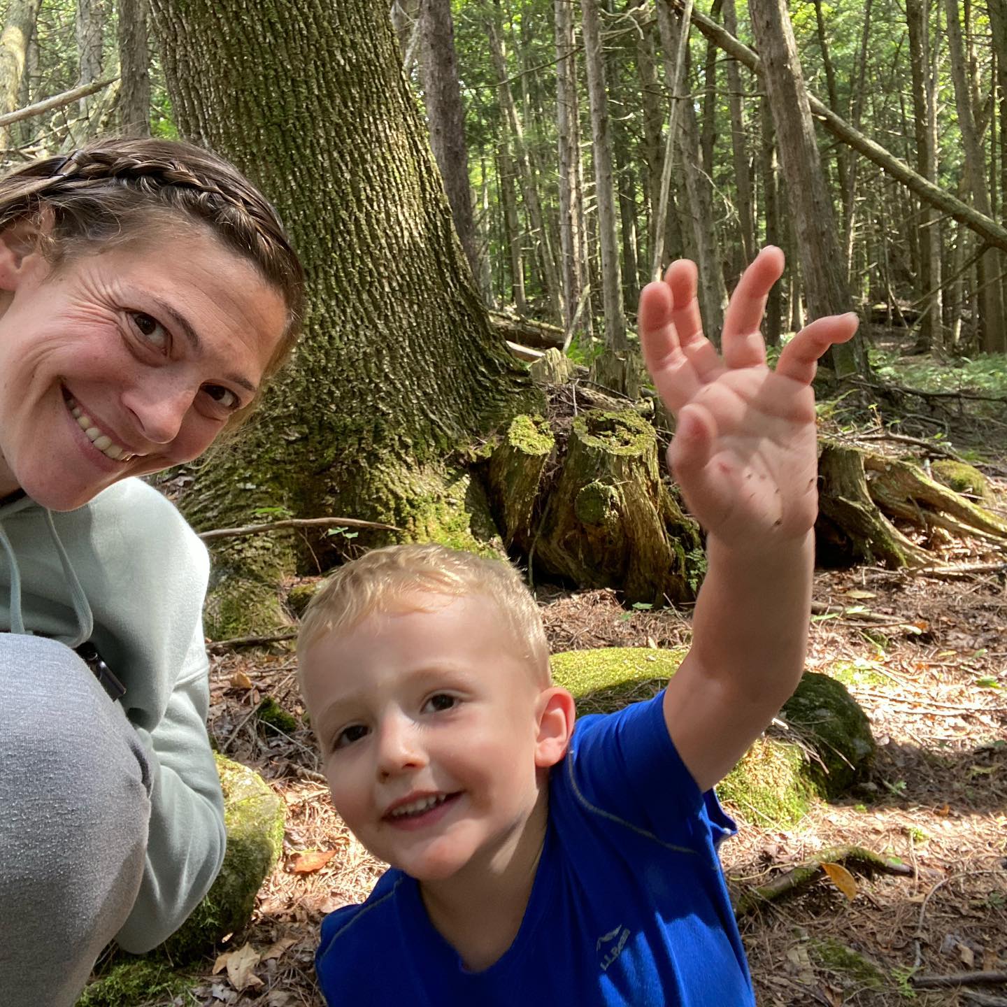 mother in son sitting in the forest