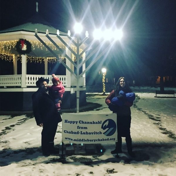IMG_5610 Author of this post with her family in front of a Menorah and a Happy Chanukah sign from Chabad Lubavitch of Middlebury