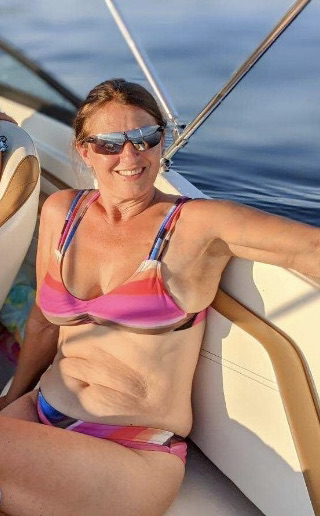 woman sits in a boat