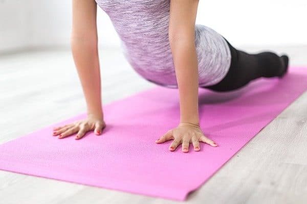 woman exercising at home