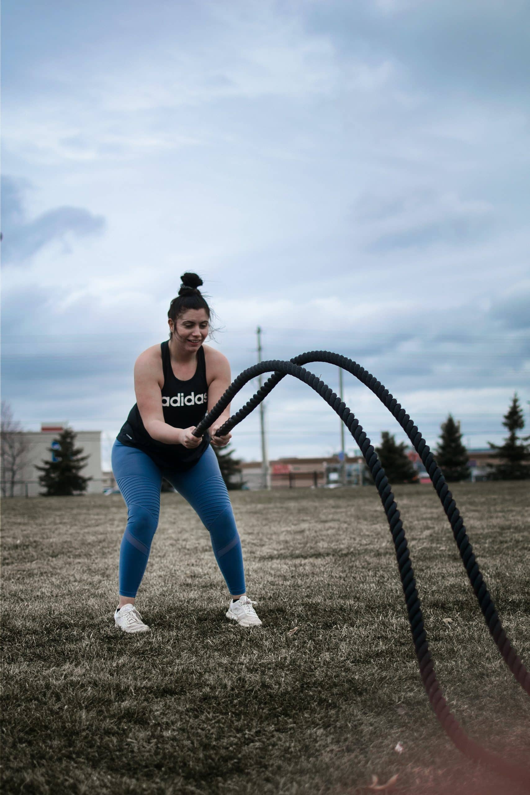 Exercising After Giving Birth- Ropes Postpartum mom vigorously exercising with ropes