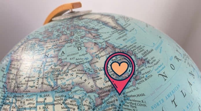 Why This Mom Loves Vermont The northwestern hemisphere of a globe, with a locational pin and a heart over Vermont.