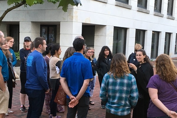 A group of people gather to hear ghost stories in downtown Burlington.