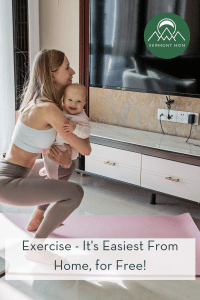 Mom exercising at home holding her baby