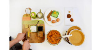 kitchen counter with prep and chef slicing lemon