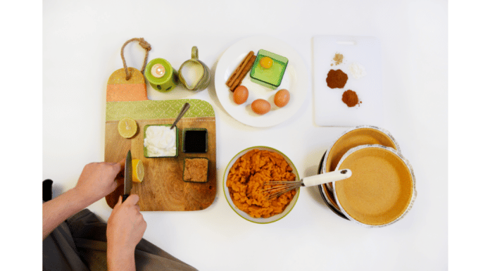The Best Cooking Tips You Can’t Live Without From a Chef kitchen counter with prep and chef slicing lemon