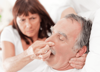 Why I Don’t Sleep With My Husband WOman plugging a sleeping man's nose