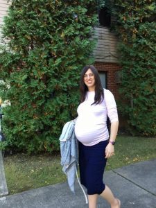 beautiful pregnant woman in a white shirt