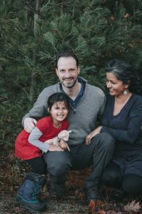 beautiful multiracial Vermont family smiling at the camera
